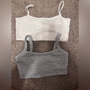 two gray tank tops/ bras